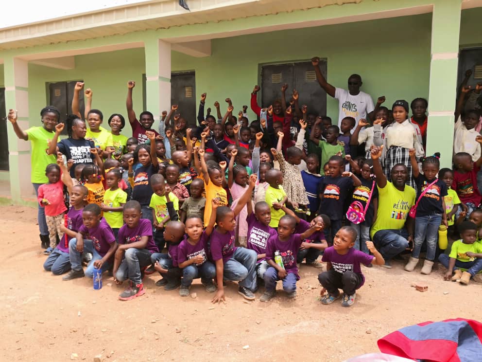 Children and community members gathered with the foundation during an outreach visit